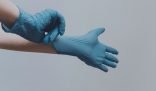 hands with cleaning gloves