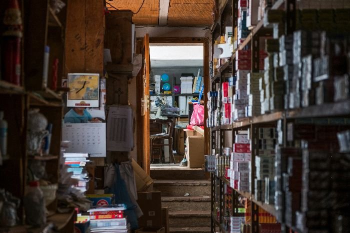 A cluttered storage room filled with various items, including potential hazardous materials, highlighting the need for careful segregation and disposal to maintain safety and organization.