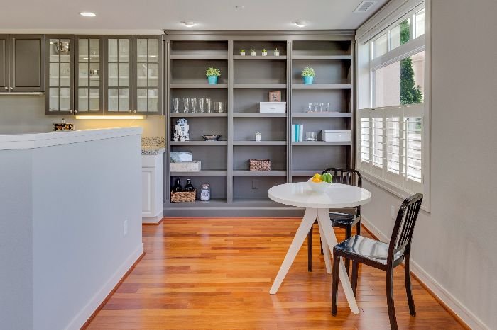 A well-organized living space with gleaming hardwood floors suggesting daily maintenance routines for long-lasting cleanliness and hygiene.