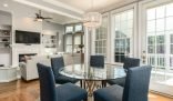 A spacious, well-lit living room with elegant furnishings, highlighting the unique cleaning challenges in large homes.