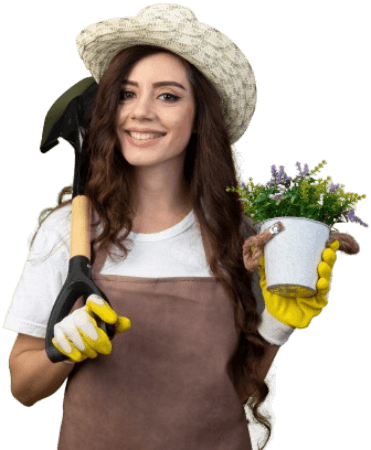A gardening professional, outfitted with gloves and a trowel, cheerfully holds a potted plant, ready to beautify and clean up patios as part of Samyx's dedicated patio cleaning services.