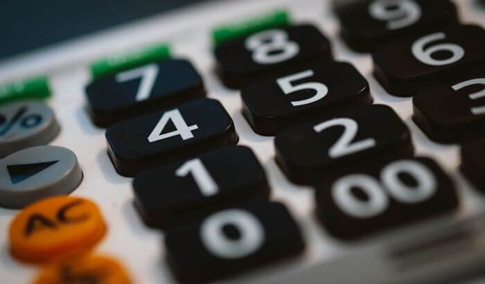 Close-up of a calculator with large buttons, symbolizing budgeting and cost management for cleaning supplies.