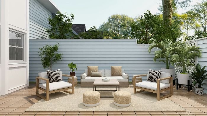 Stylish outdoor patio setup with modern furniture on a well-maintained deck, illustrating the importance of proper cleaning techniques to avoid common maintenance mistakes.