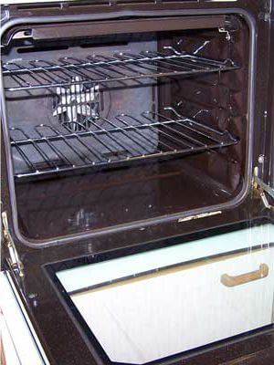 Clean oven with shiny surfaces after end of tenancy cleaning.
