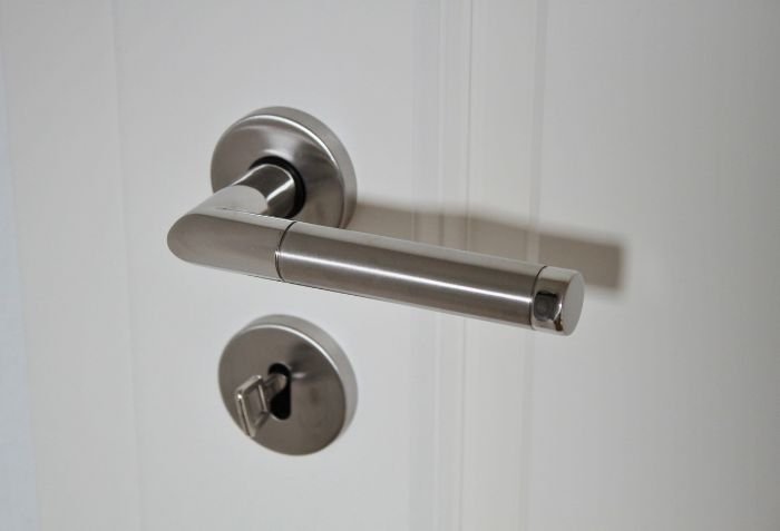 A clean and shiny door handle, highlighting the importance of cleaning doors and handles during an end of tenancy cleaning in London.