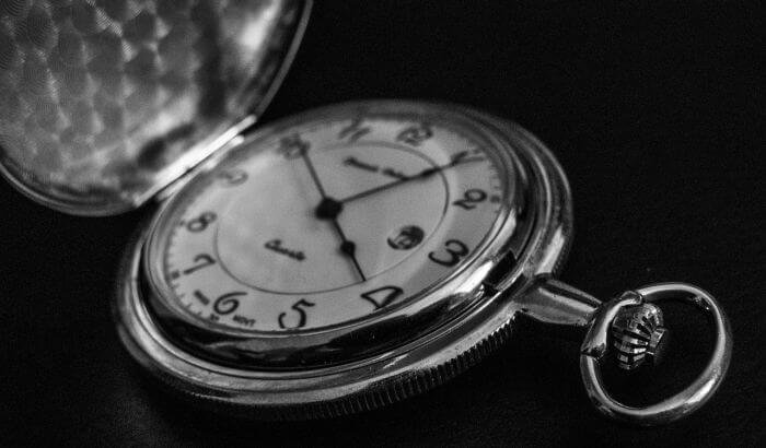 A vintage pocket watch symbolizing the concept of decluttering your home in short, 5-minute sprints for effective time management.