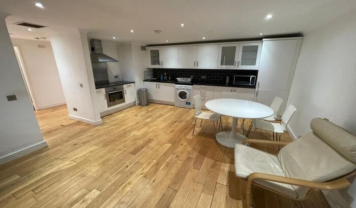 A clean and modern kitchen and dining area showcasing the remarkable transformation achieved through end of tenancy cleaning in Chingford, E4.
