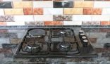 Clean stovetop as part of end of tenancy cleaning tips for tenants moving out.
