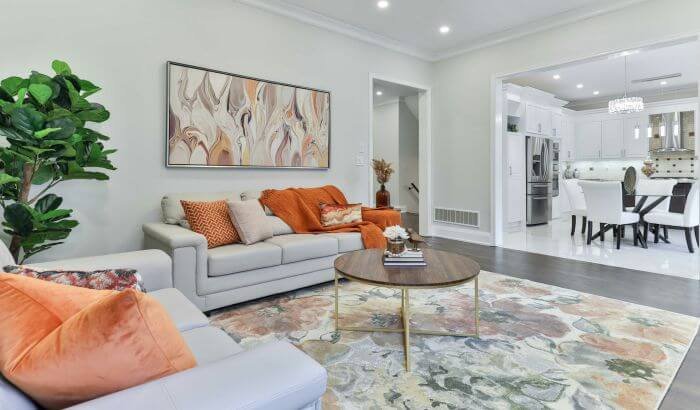 A well-maintained living room with stylish decor, illustrating the importance of detailed cleaning in luxury properties.
