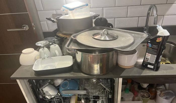 Cluttered kitchen with dirty dishes and cookware, illustrating the starting point of a tenancy cleaning case study in Paddington, W2.
