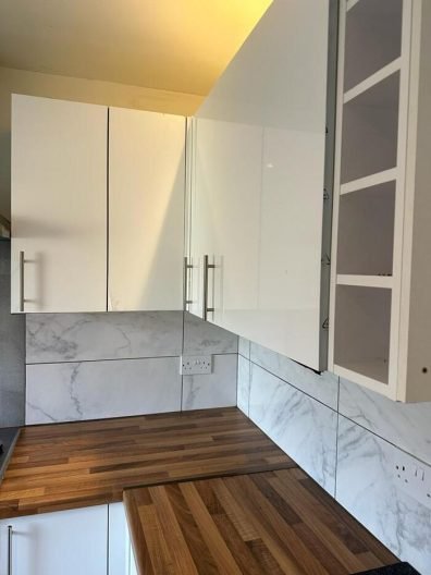 Clean kitchen cabinets and countertops after end of tenancy cleaning in Battersea, SW8
