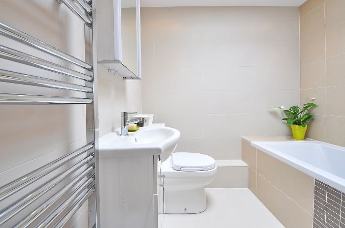 Clean and tidy bathroom with modern fixtures, emphasizing the importance of monthly deep cleaning tasks for hygiene and freshness.