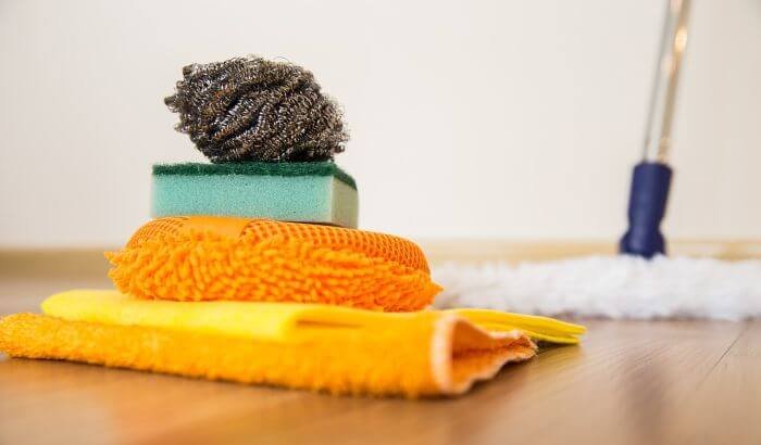 Cleaning brushes and sponges stacked together, illustrating the perfect combination for effective scrubbing and cleaning tasks.