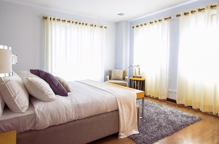 Bright and tidy bedroom, highlighting the benefits of customizable cleaning plans tailored to individual needs and schedules.
