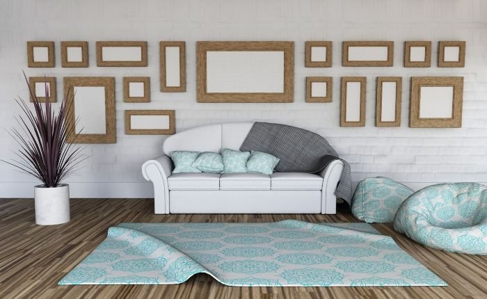 Living room with a patterned rug, couch, and decorative frames, illustrating the importance of deep cleaning carpeted areas to remove dirt and stains.