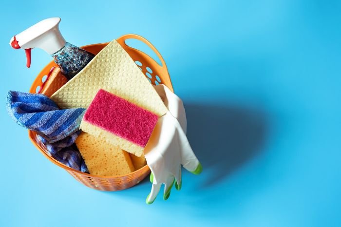 Close-up of various cleaning sponges, including foam, cellulose, and microfiber, highlighting their differences for specific cleaning tasks.