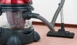 Vacuum cleaner on a carpet demonstrating how to use it effectively for a spotless home.