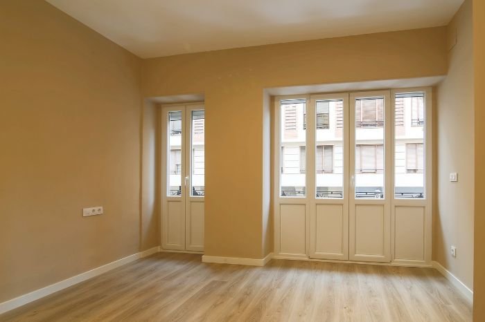 Empty, spotless room after a successful end of tenancy clean, showcasing expert cleaning tips for securing a deposit return.