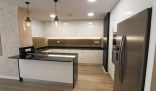 Modern kitchen cleaned to perfection, showcasing tips from a professional end of tenancy cleaner for a spotless finish.