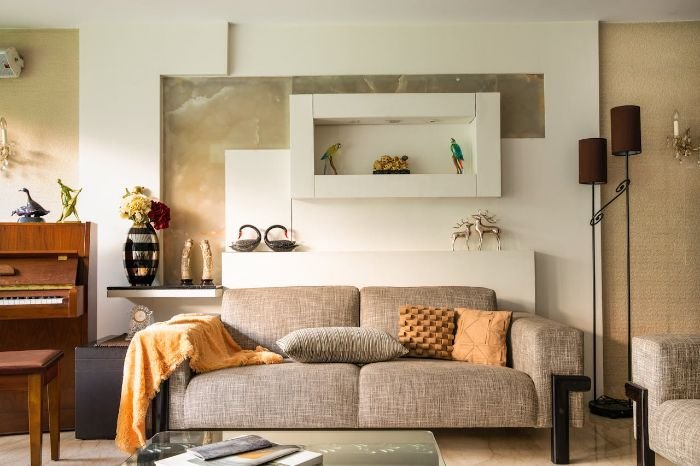 A living room showcasing the difference between signs of neglect and normal usage, emphasizing cleanliness, upkeep, and the importance of addressing damage.