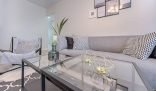 Modern living room with a clean, minimalist setup, representing the high standards of end of tenancy cleaning services in London.