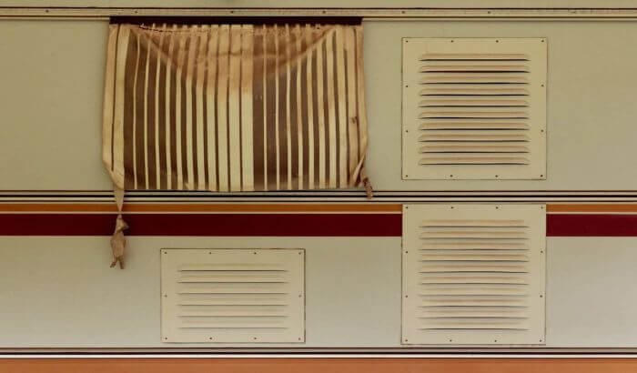 Close-up of dirty and neglected air vents, highlighting the need for regular cleaning to avoid poor air quality and maintain an efficient ventilation system.
