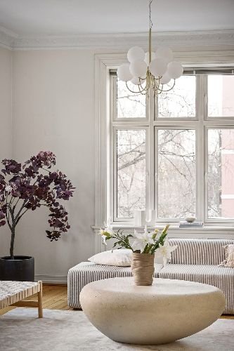 Elegant living room with clean windows and furniture in Chigwell, IG7, showcasing professional end of tenancy cleaning results.