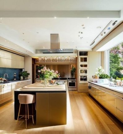 Luxury modern kitchen cleaned to perfection in Covent Garden, WC2, with spotless countertops, appliances, and natural light streaming through large windows.