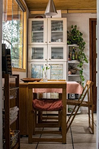 Clean and cozy dining area with wooden furniture and natural lighting after professional end of tenancy cleaning in Friern Barnet, N11.