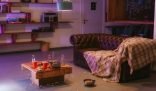 A cluttered and untidy living room with an unclean table, scattered popcorn, and an unkempt couch, highlighting the risks of neglecting regular home cleaning.