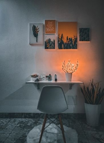 Modern living area in East Sheen, SW14, featuring a decorative wall display and chair, after a professional end of tenancy cleaning by Samyx Cleaning.