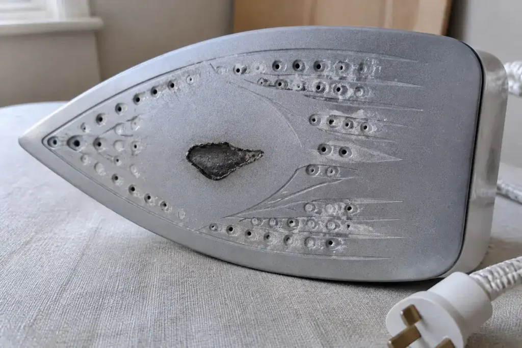 How to Clean Your Burnt Iron with (Mostly) Natural Products 4 Burnt synthetic residue and pale mineral marks on a cool iron soleplate